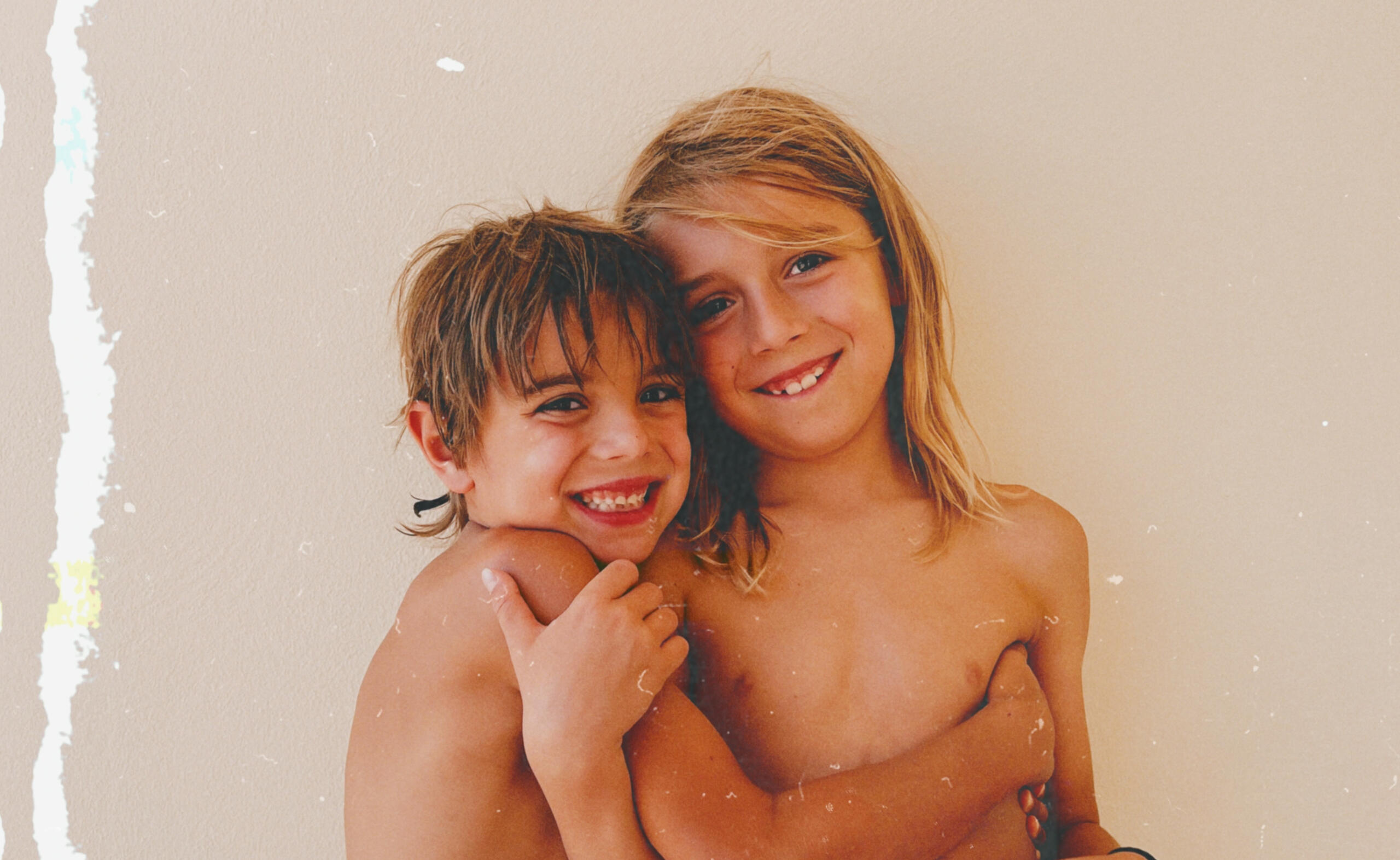 Two brothers hugging Two slightly older brothers, hugging each other