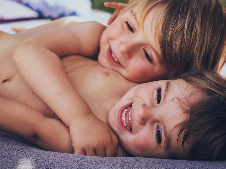 Two toddlers hugging Two little brothers hugging each other